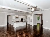 Enlarged Kitchen Island overlooking Family Room in Brookhaven Ashford built by Waterford Homes